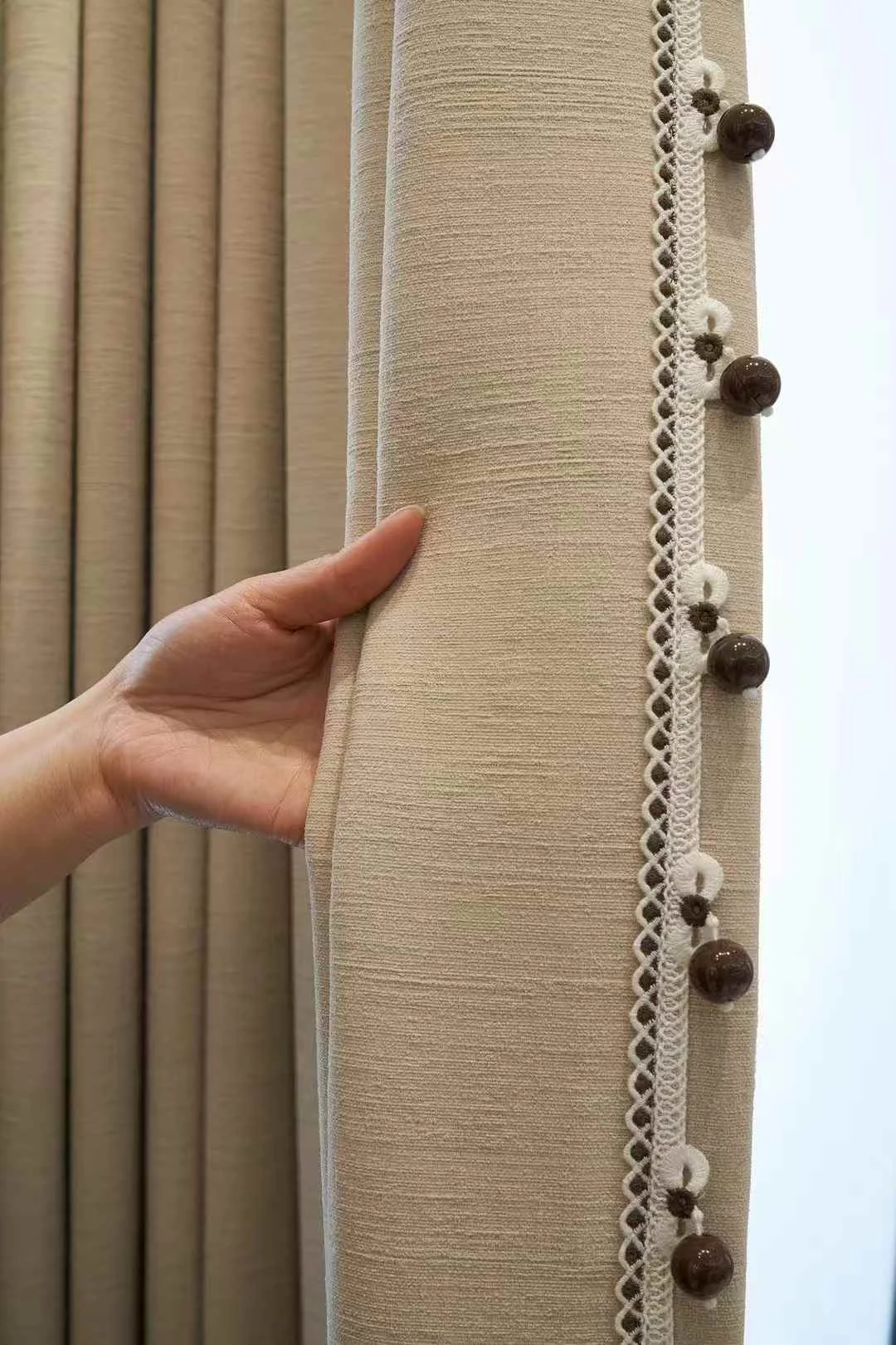 Sand-taupe textured drape — supplied curtain design reference.