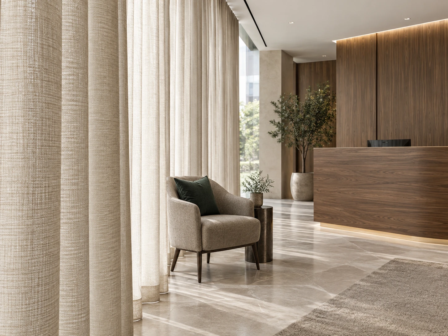 Office reception with full-height oatmeal woven curtains, coordinated upholstered guest seating and a natural timber reception counter, showing how fabric texture connects the finishes.