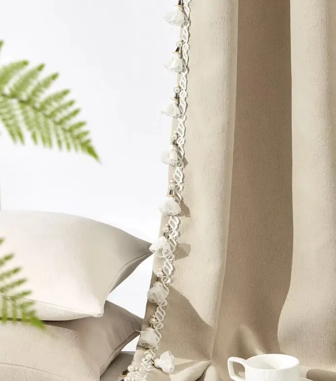 Light-colored curtain with a tie-back, styled with a fern plant – ideal for bringing natural elements into boho or rustic interior design