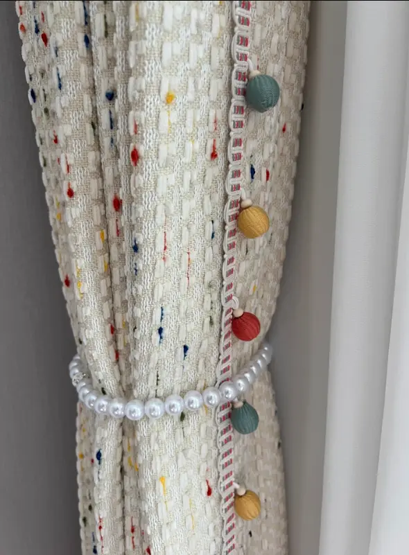 Light-colored curtain with decorative tie-back – elegant window treatment for bright, airy living spaces in classic interior design