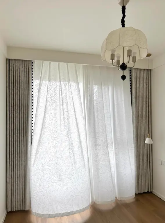 Elegant white curtain in a well-lit room with classic decor – perfect for timeless, sophisticated interior design