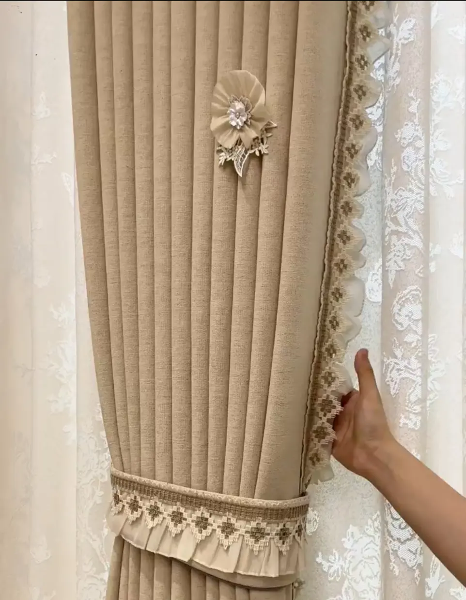 Close-up of subtle woven texture on luxury silk curtain fabric for Modern Chinese interior design.