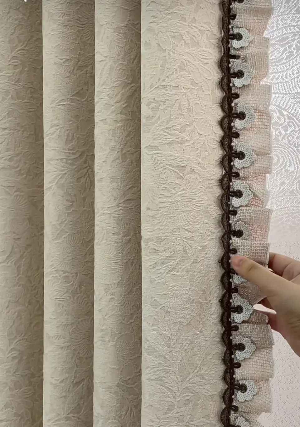 Luxury interior design featuring floor-to-ceiling draped curtains.