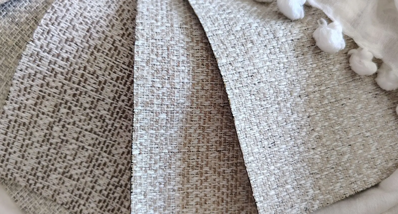 Soft, neutral-toned textile swatch – versatile fabric for curtains, upholstery, or rugs in minimalist interior design