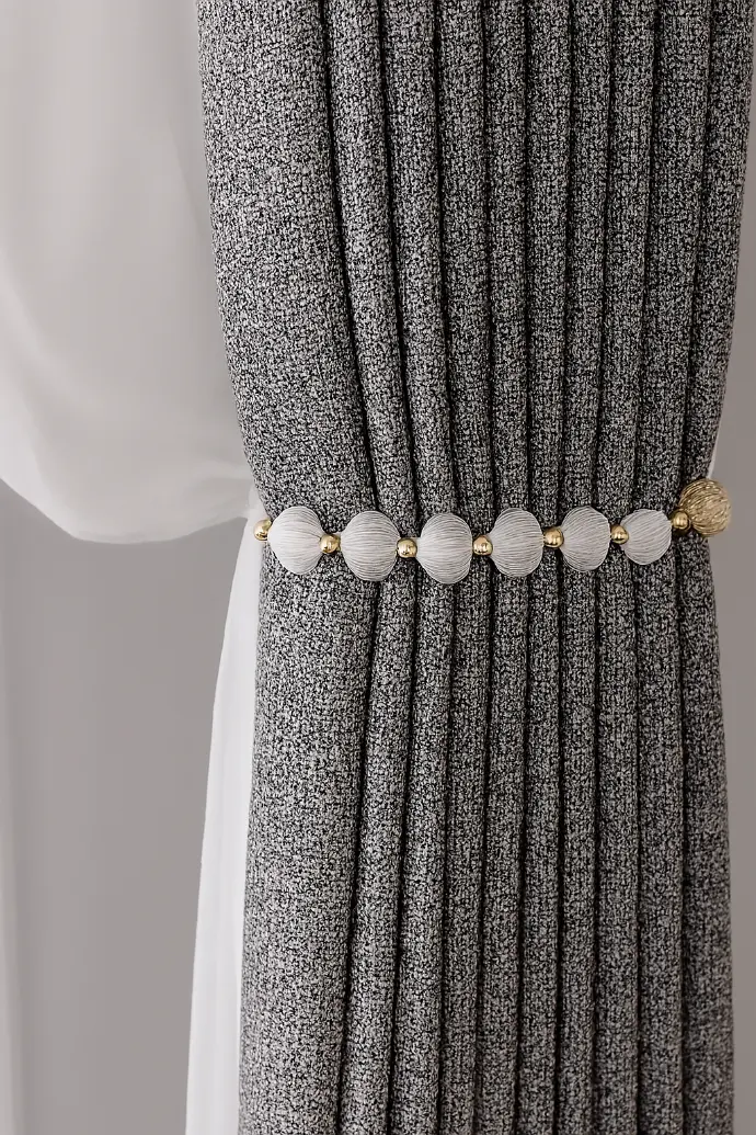 (textile): Dark textured fabric swatch with subtle pattern – versatile upholstery material for modern furniture and home decor.