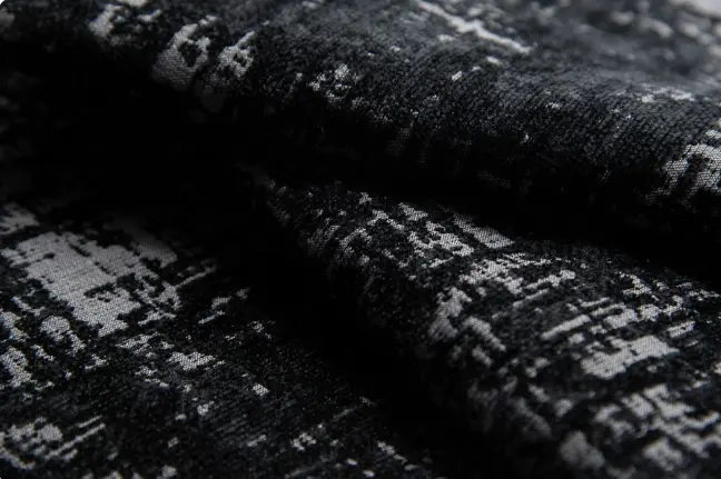 Sleek modern living room with black leather sectional sofa, glass coffee table, floor-to-ceiling curtains, and recessed lighting – contemporary open-concept living space decor ideas for urban homes.