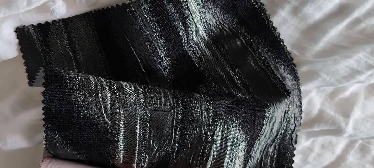 Luxury dark fabric with a subtle sheen – perfect for elegant curtains, upholstery, or accent pieces in modern interior design