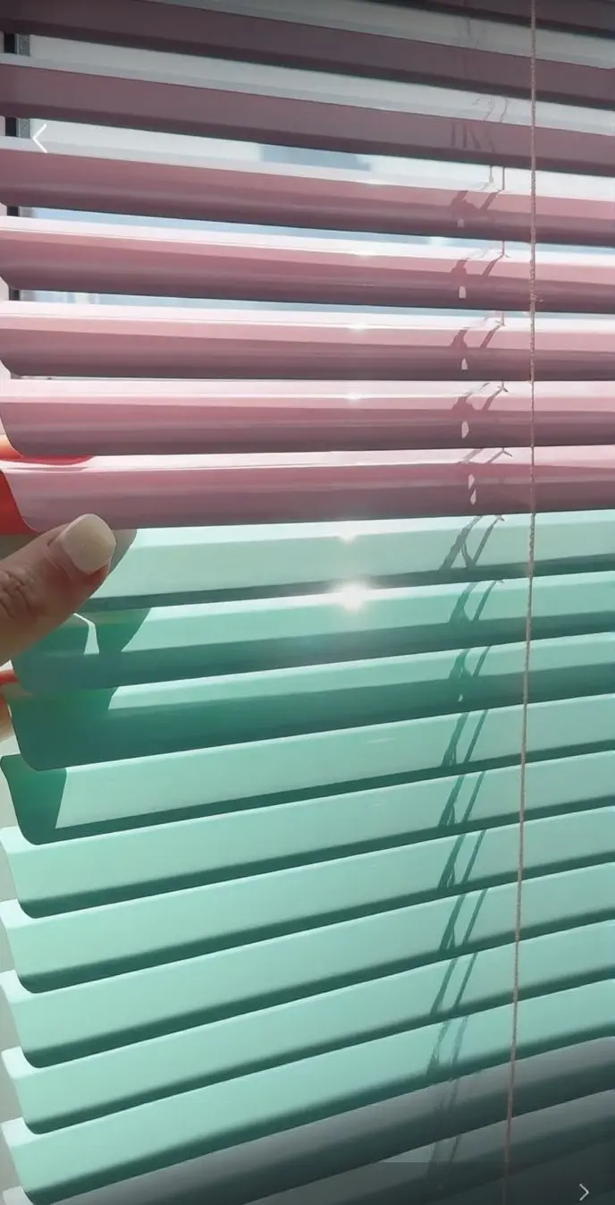 (colored blinds): Assorted colored horizontal window blinds (pink, green), vibrant window coverings for home decor