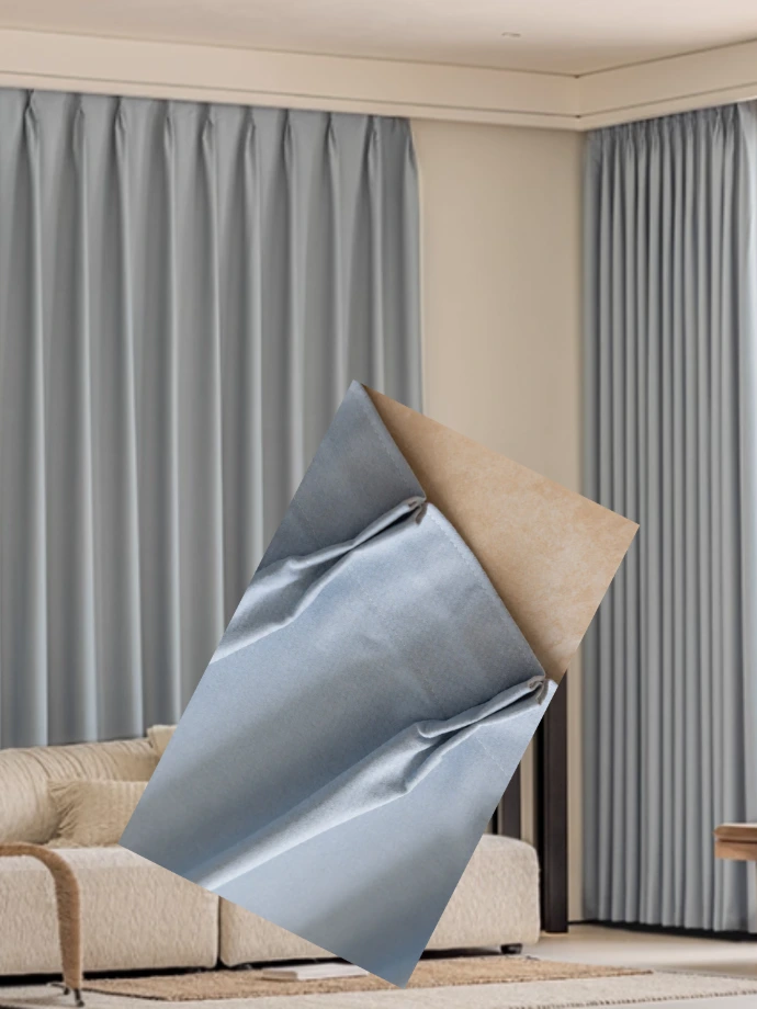 Soft gray textured curtains (semi-sheer) drawn to the side of a window  double pleat contemporary bedroom window decor.